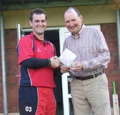 James Hall receives the Ulster Bank Man of the Match award from Gordon Scott following Waringstown's win over Lurgan