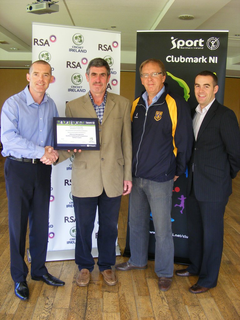 Saintfield CC Chairman Noel McCarey receives the Cricket Ireland / Clubmark NI certificate from Tim Simmonite, National Development Manager for Cricket Ireland. They are alongside William Radcliffe from Saintfield CC and Simon Toole, Performance Consultant for Sport NI